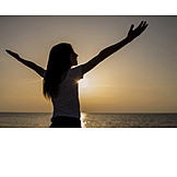   Girl, Sunset, Arms Outstretched