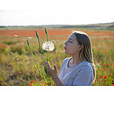   Young Woman, Dandelion, Blowing