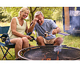   Laughing, Camping, Older Couple, Marshmallows